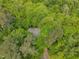 Aerial view of the home nestled among lush trees and foliage, providing privacy at 2901 Horse Shoe Farm Rd, Wake Forest, NC 27587