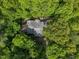 Overhead view shows a home surrounded by dense, green trees, creating a secluded atmosphere at 2901 Horse Shoe Farm Rd, Wake Forest, NC 27587