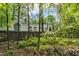 Exterior of home with a deck and lattice in a secluded backyard and a flowering tree at 2901 Horse Shoe Farm Rd, Wake Forest, NC 27587