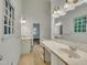 Bright bathroom featuring double sinks, ample vanity space, and neutral color palette at 2901 Horse Shoe Farm Rd, Wake Forest, NC 27587