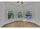 Bright bedroom with three large windows offering ample natural light at 2901 Horse Shoe Farm Rd, Wake Forest, NC 27587
