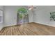 Spacious bedroom featuring wood floors and large arched window offering views at 2901 Horse Shoe Farm Rd, Wake Forest, NC 27587