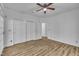 Bedroom featuring hardwood floors, closet with sliding doors, and doorway to an adjacent room at 2901 Horse Shoe Farm Rd, Wake Forest, NC 27587