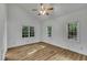 Bright bedroom featuring wood flooring, natural light, and a neutral color palette at 2901 Horse Shoe Farm Rd, Wake Forest, NC 27587