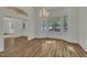 Open dining room featuring a chandelier, large windows, and wood floors at 2901 Horse Shoe Farm Rd, Wake Forest, NC 27587