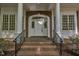 Welcoming front porch with brick stairs and elegant white columns at 2901 Horse Shoe Farm Rd, Wake Forest, NC 27587