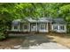 Elegant one-story home with a white facade and well-manicured lawn at 2901 Horse Shoe Farm Rd, Wake Forest, NC 27587