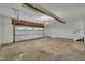 Spacious garage with room for vehicles and storage, including stairs to another area at 2901 Horse Shoe Farm Rd, Wake Forest, NC 27587