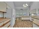 Spacious kitchen with wood floors, cabinetry, and large windows for natural light at 2901 Horse Shoe Farm Rd, Wake Forest, NC 27587