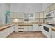 Functional kitchen with white appliances, light wood countertops, and hardwood floors, offering a practical cooking area at 2901 Horse Shoe Farm Rd, Wake Forest, NC 27587