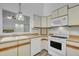 Bright kitchen featuring white appliances, wood countertops, and hardwood floors, providing a clean and efficient cooking space at 2901 Horse Shoe Farm Rd, Wake Forest, NC 27587