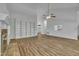 Large living room with hardwood floors and a brick fireplace, complemented by a built-in bookshelf for storage and display at 2901 Horse Shoe Farm Rd, Wake Forest, NC 27587