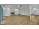 Bright living room featuring hardwood floors, a fireplace, and a built-in bookshelf, creating a welcoming and functional space at 2901 Horse Shoe Farm Rd, Wake Forest, NC 27587