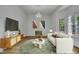 Cozy living room with modern furniture, stylish rug, and natural light at 2901 Horse Shoe Farm Rd, Wake Forest, NC 27587