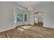 Bright living room with hardwood floors and large windows offering ample sunlight at 2901 Horse Shoe Farm Rd, Wake Forest, NC 27587