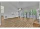 Spacious living room featuring hardwood floors and french doors leading to the outside, offering seamless indoor-outdoor living at 2901 Horse Shoe Farm Rd, Wake Forest, NC 27587