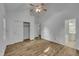 Spacious main bedroom with wood flooring, ceiling fan, closet, and en suite bathroom at 2901 Horse Shoe Farm Rd, Wake Forest, NC 27587