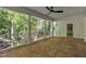 Covered porch featuring white columns and latticework railing with wooded backyard views at 2901 Horse Shoe Farm Rd, Wake Forest, NC 27587