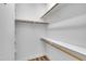 Walk-in closet with built-in shelving and wooden racks for storage and organization at 2901 Horse Shoe Farm Rd, Wake Forest, NC 27587