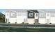 New construction townhome featuring gray and white exterior with an attached garage at 3010 Vitner Dr, Durham, NC 27704
