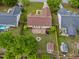 Aerial perspective of the home with a fenced backyard, brick patio, fire pit, and landscaping at 308 Holly Briar Dr, Fuquay Varina, NC 27526