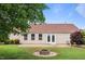 Backyard featuring brick patio and fire pit at 308 Holly Briar Dr, Fuquay Varina, NC 27526