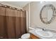 Well-lit bathroom features decorative mirror and shower with curtain at 308 Holly Briar Dr, Fuquay Varina, NC 27526