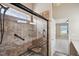 Updated bathroom with a glass-enclosed shower, built-in seat, and modern finishes at 308 Holly Briar Dr, Fuquay Varina, NC 27526