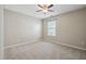 Bedroom features neutral carpet, ceiling fan and a window providing natural light at 308 Holly Briar Dr, Fuquay Varina, NC 27526