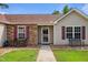 Inviting front entrance featuring stone accents, benches, and a well-maintained walkway at 308 Holly Briar Dr, Fuquay Varina, NC 27526