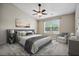 Well-decorated bedroom with a large window, stylish furniture, and plenty of natural light at 308 Holly Briar Dr, Fuquay Varina, NC 27526