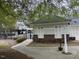 Exterior of the community pool house showing access to the pool area behind a black iron fence at 308 Holly Briar Dr, Fuquay Varina, NC 27526