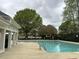 Community pool with ample seating and well-maintained grounds provides a relaxing atmosphere at 308 Holly Briar Dr, Fuquay Varina, NC 27526