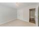 Neutral-walled bedroom with carpet and base trim features a closet, chandelier and doorway at 315 Copper Ridge Dr, Sanford, NC 27330