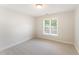 Neutral-walled bedroom with soft carpet features a window to let the sunshine in at 315 Copper Ridge Dr, Sanford, NC 27330