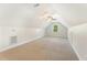 A bonus room with neutral walls and soft carpet features a ceiling fan and a window at 315 Copper Ridge Dr, Sanford, NC 27330