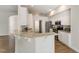 Elegant kitchen features white cabinetry, granite countertops, and stainless steel appliances at 315 Copper Ridge Dr, Sanford, NC 27330