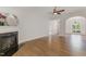 Comfortable living room with hardwood floors, a fireplace, and abundant natural light at 315 Copper Ridge Dr, Sanford, NC 27330