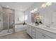 Bathroom featuring double vanity, soaking tub, and separate glass enclosed shower at 316 Barley Mill Rd, Holly Springs, NC 27540