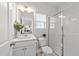 Clean bathroom featuring a glass shower, toilet, and vanity with a mirror at 316 Barley Mill Rd, Holly Springs, NC 27540