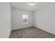 Clean bedroom with neutral carpet, a window letting in natural light, and simple decor at 316 Barley Mill Rd, Holly Springs, NC 27540