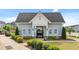 Charming clubhouse with well-manicured landscaping and ample parking at 316 Barley Mill Rd, Holly Springs, NC 27540