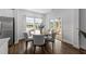 Bright dining area with a round table, six chairs, and natural light at 316 Barley Mill Rd, Holly Springs, NC 27540