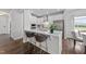 Stylish kitchen with stainless steel appliances, white cabinetry, and a center island with seating at 316 Barley Mill Rd, Holly Springs, NC 27540