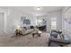 Bright living room featuring modern furniture, neutral tones, and lots of natural light at 316 Barley Mill Rd, Holly Springs, NC 27540