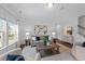 Inviting living room with neutral tones, modern decor, and hardwood flooring throughout at 316 Barley Mill Rd, Holly Springs, NC 27540