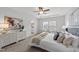 Bright bedroom with a large bed, decorative dresser, and a glimpse into the ensuite bathroom at 316 Barley Mill Rd, Holly Springs, NC 27540