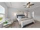 Spacious bedroom featuring a ceiling fan, neutral walls, and comfortable furniture at 316 Barley Mill Rd, Holly Springs, NC 27540