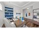 Stylish office with a modern desk, built-in shelving, and an adjacent foyer entryway at 316 Barley Mill Rd, Holly Springs, NC 27540