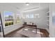 Bright and airy office space with a large window, tray ceiling, and built-in shelving at 316 Barley Mill Rd, Holly Springs, NC 27540
